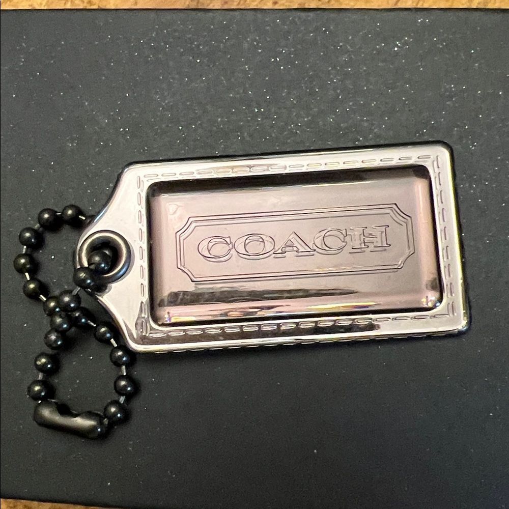 Coach Poppy plastic hangtag smoky gray with chunky ballchain